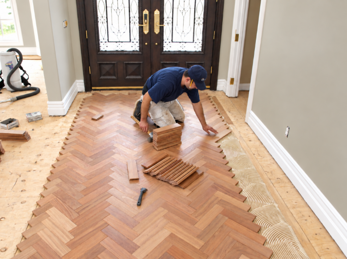 Herringbone Flooring Installation in Bright Foyer