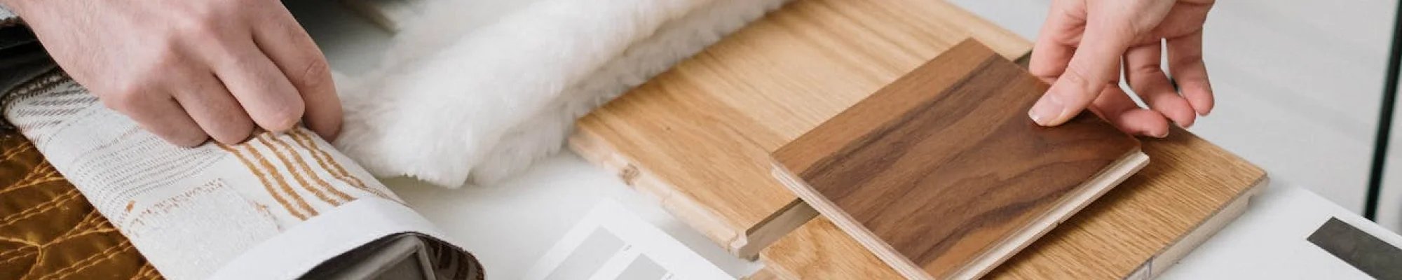Comparing flooring samples during a design consultation in Malibu, CA